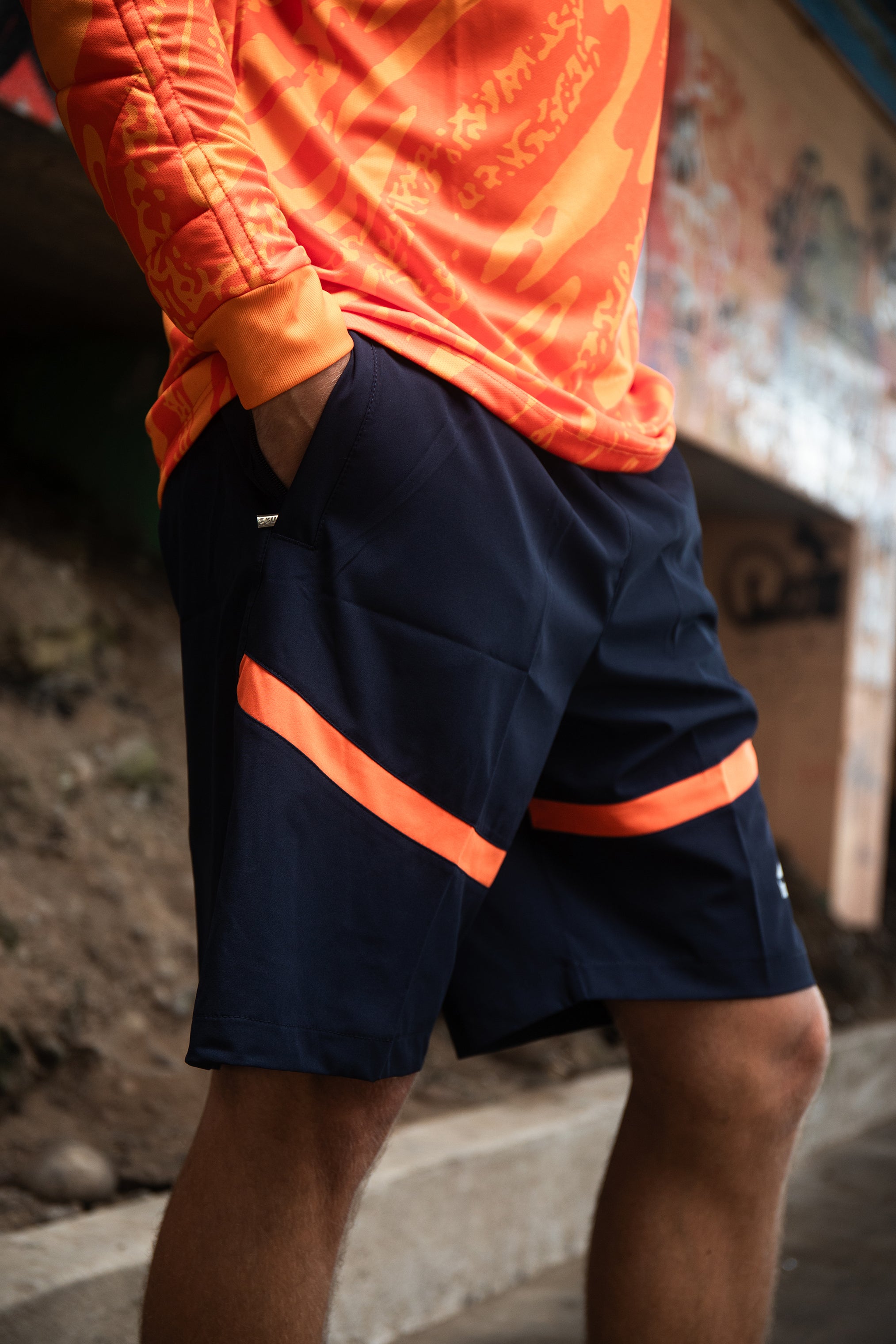 Short Lomas Active Flex Azul noche c/ Naranja